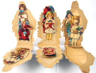 Christmas-themed die-cut paper doll set.